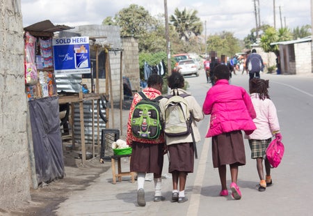 Children walking with backpacks.
