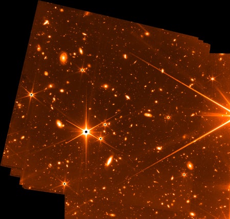 Distant galaxies fill the background of this engineering test image taken by the James Webb Space Telescope's Fine Guidance Sensor