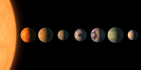 An artist's rendering shows approximations of the seven planets of the TRAPPIST-1 system.