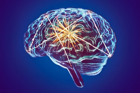 Photo illustration of a glass brain with fireworks inside on a blue background