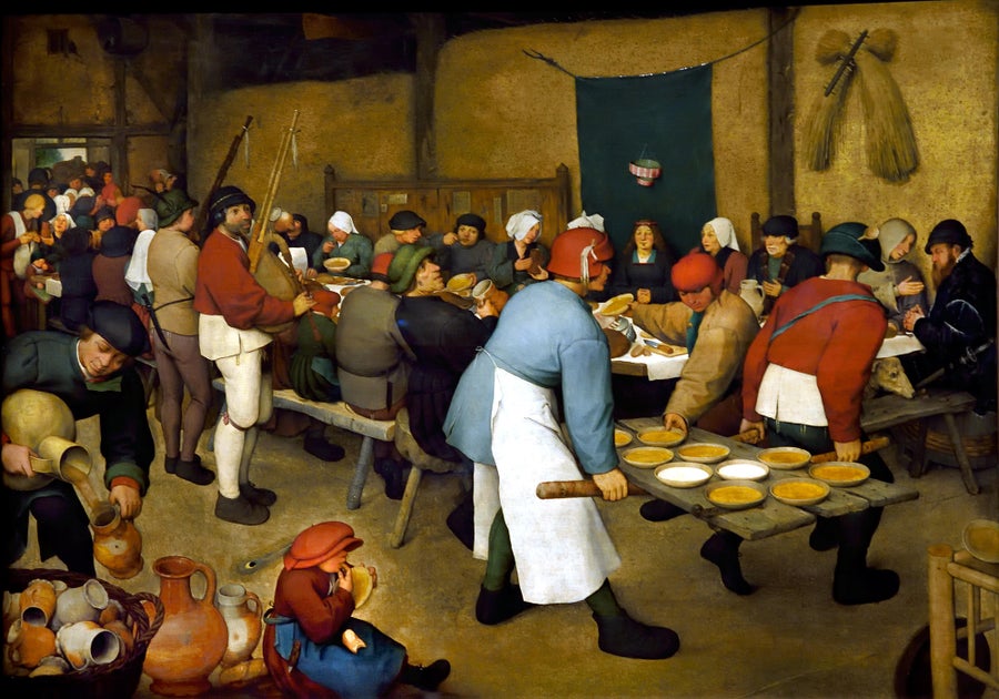 Painting depicting a feast in a barn.