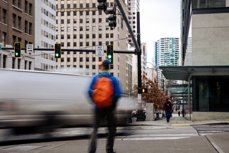 Busy intersection in downtown Seattle, Washington with motion blur of moving vehicles and pedestrians