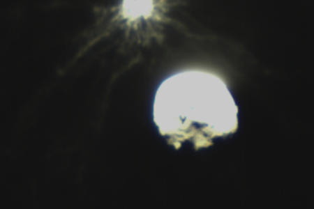 Debris plume spraying out from the DART spacecraft smashing into Dimorphos.